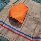 Woobie Hank: Insulated with USGI poncho-liner, serves as a large rag, knee pad, and adventure companion tool.