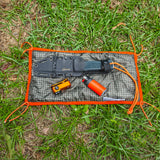 Woobie Hank: Insulated with USGI poncho-liner, serves as a large rag, knee pad, and adventure companion tool.