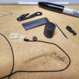 SERE Lanyard: Escape Implements and EDC Tools secured around a kevlar friction saw necklace.