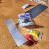 Field Repair Patch Kit - Fix broken items, stitch torn bags, parch tent rips, and seal holes.