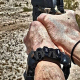 Urban Carry Strap - EDC Bracelet Titanium Pry Bar, Firestarter, Bottle Opener, Kevlar Saw, Cuff Key.